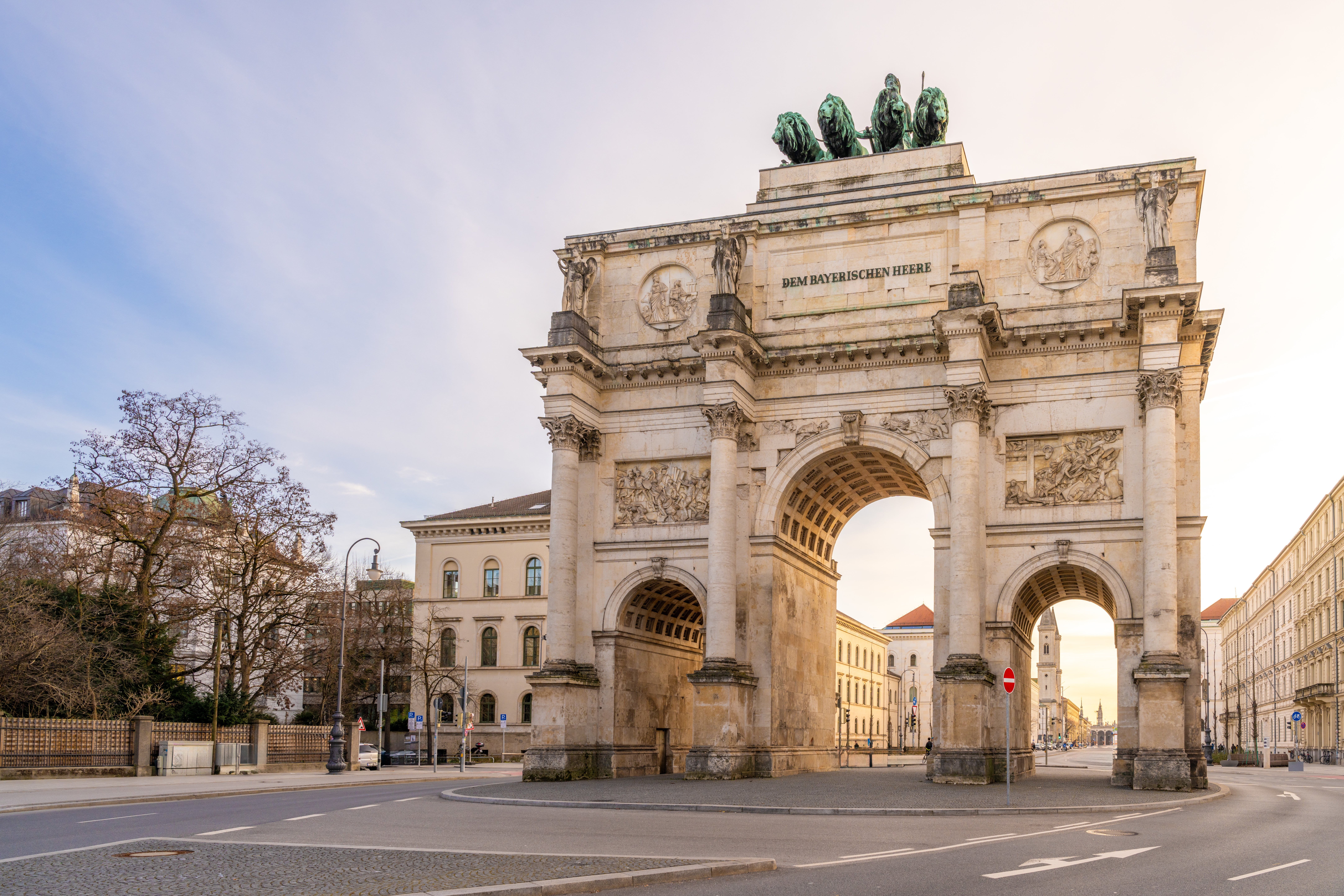 Triumphal Arch successful Munich stands connected an bare street, adorned with classical sculptures and a Latin inscription