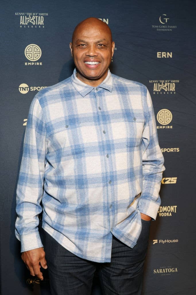 Person wearing a plaid shirt, smiling at a sports event backdrop. The article focuses on work and money topics