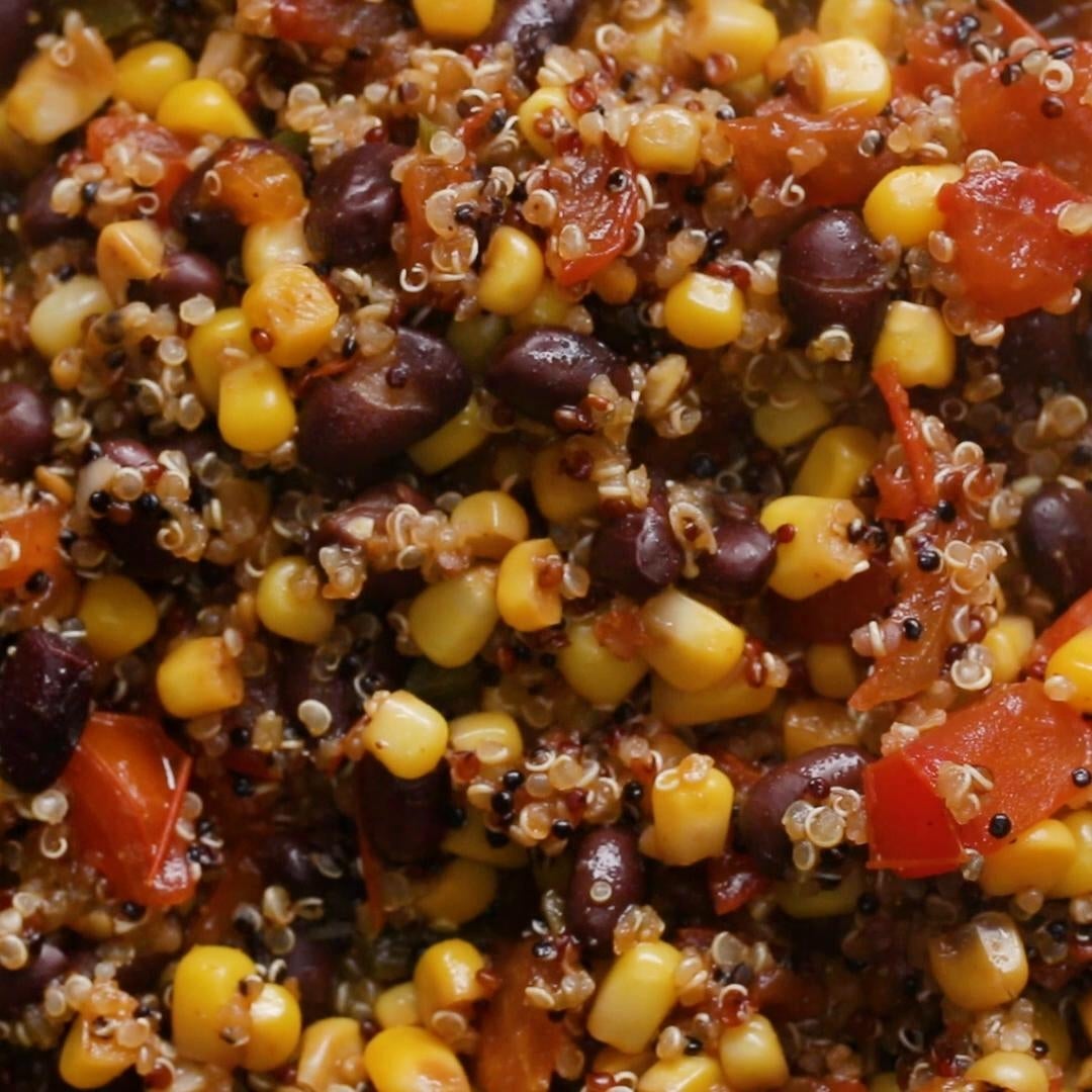 Quinoa salad with black beans, corn, and diced tomatoes, showcasing a mix of textures