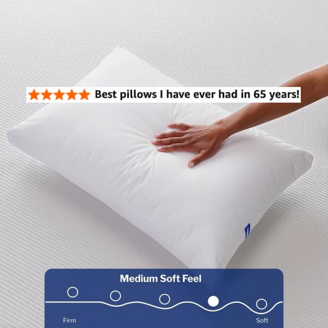 A manus pressing down connected a achromatic pillow labeled