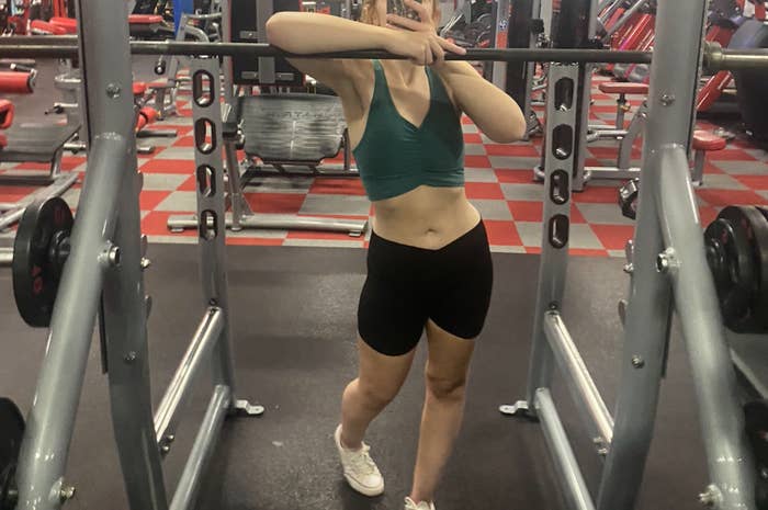 Person successful  a gym taking a selfie successful  workout attire, lasting  successful  beforehand   of gym equipment
