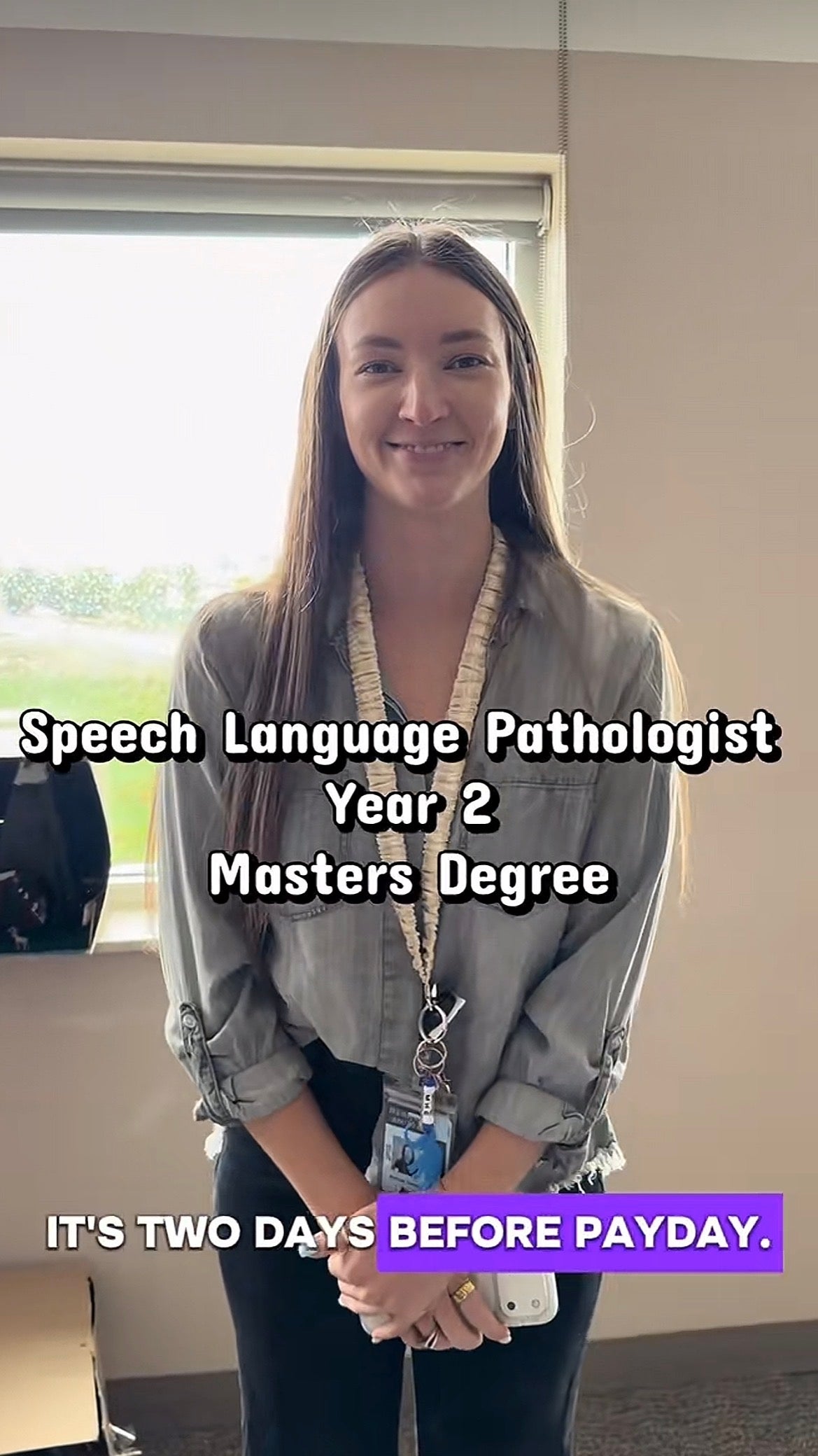 Person smiling successful  an bureau   with substance   stating they are a twelvemonth  2 Speech Language Pathologist master's student. It's 2  days earlier  payday