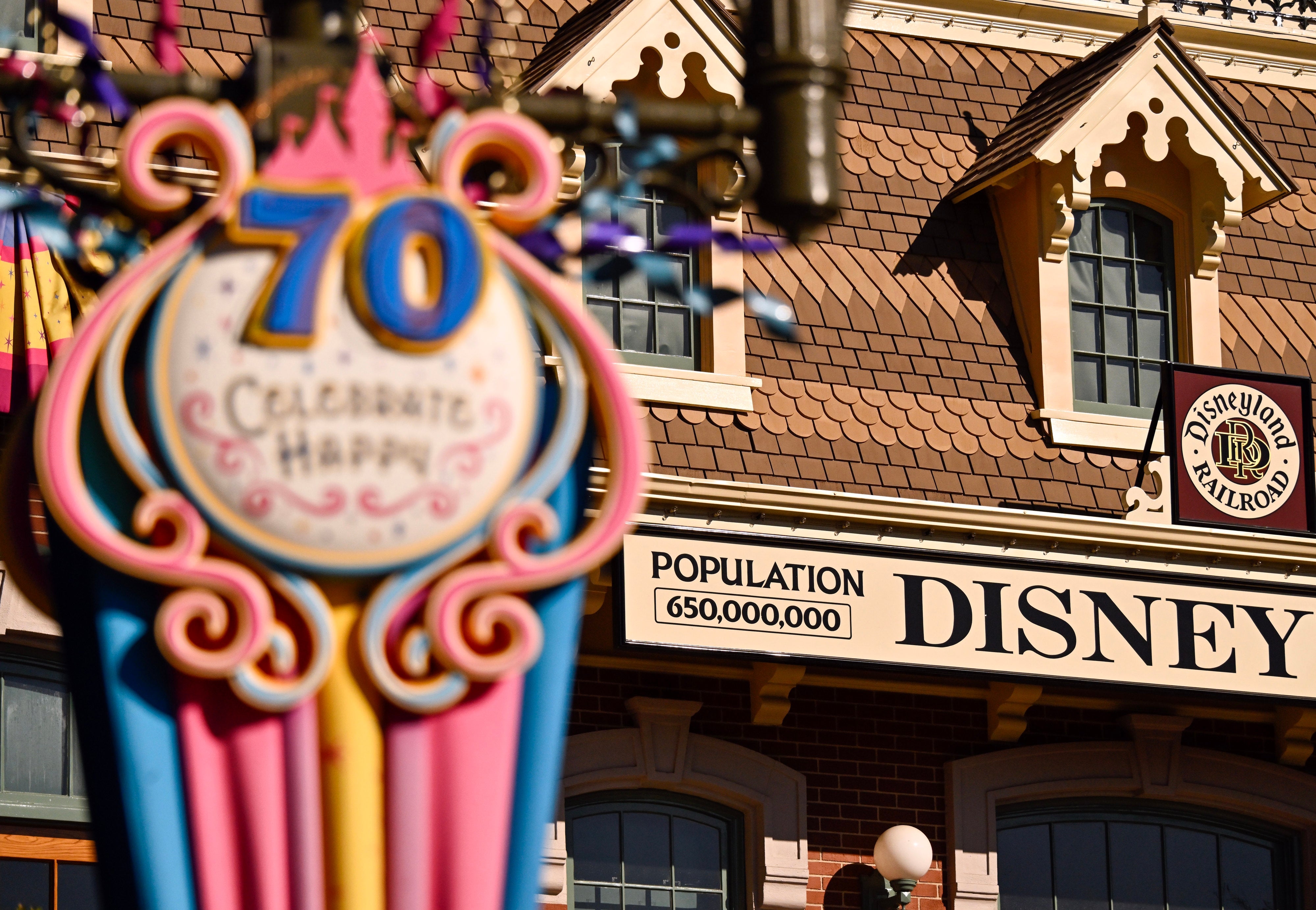 A Disneyland motion celebrates 70 years with a colonisation number of 650,000,000 adjacent the Disneyland Railroad entrance