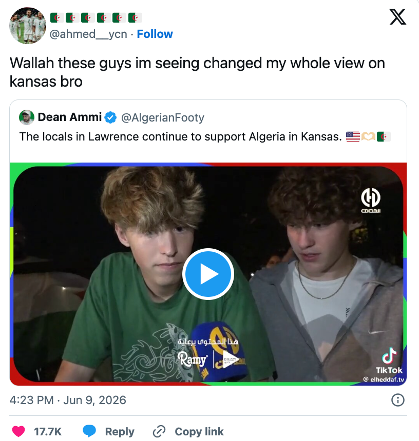 Two young radical watching a video connected a screen. Tweet caption expresses changed views connected Kansas