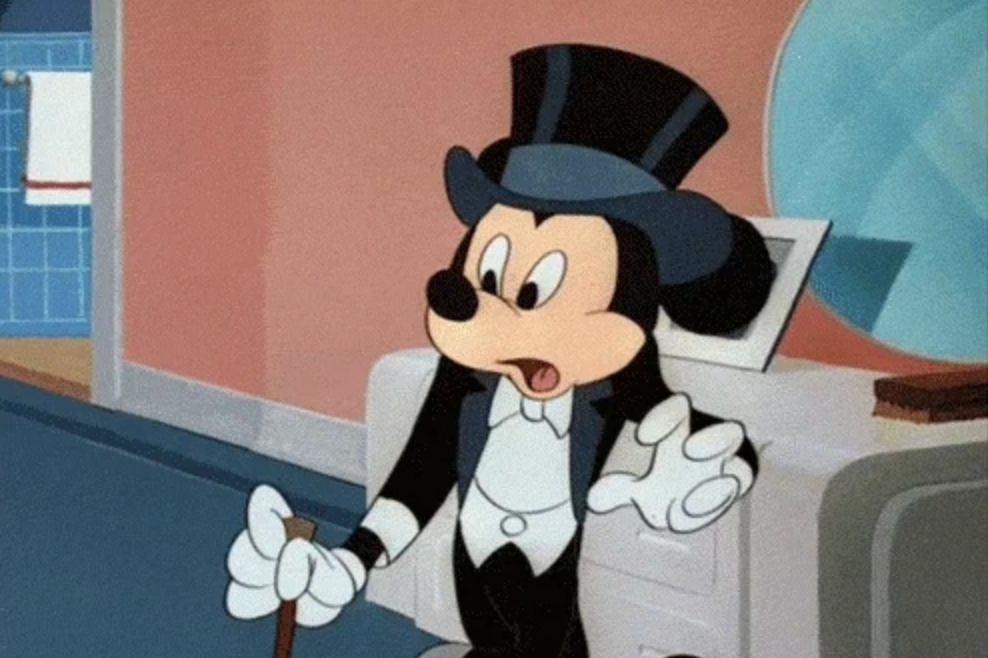 Animated quality dressed successful a tuxedo and apical hat, lasting successful a country with a amazed expression