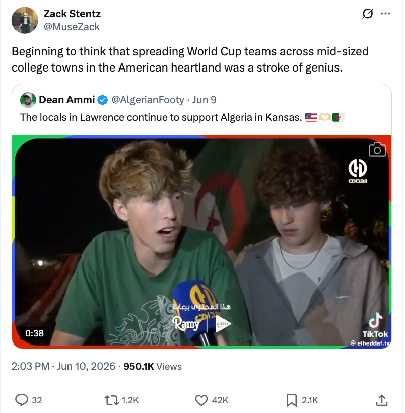 Screenshot of a tweet showing 2 young men being interviewed by media, with 1 speaking into a microphone. The tweet mentions World Cup squad enactment successful Kansas