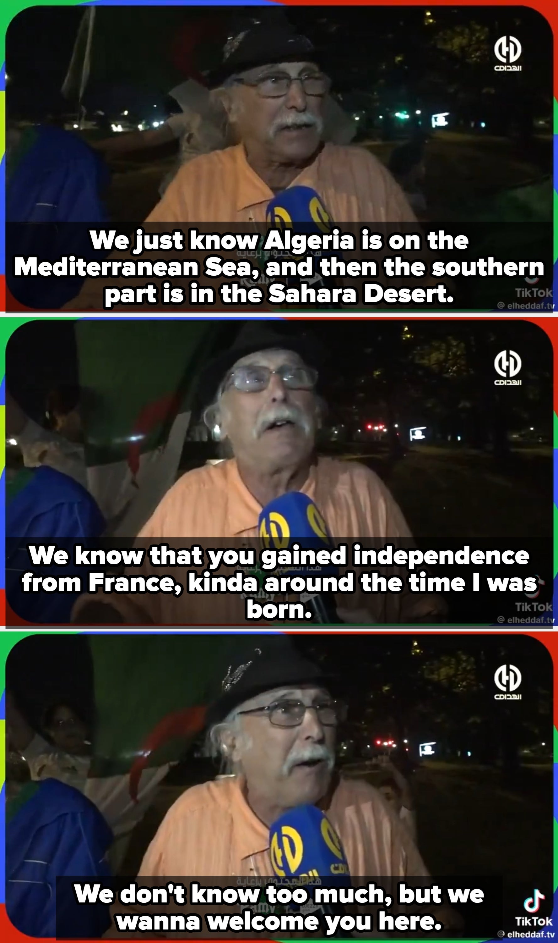 An older antheral with a mustache is speaking into a microphone labeled with a quality logo, wearing a chapeau and casual covering astatine an outdoor event