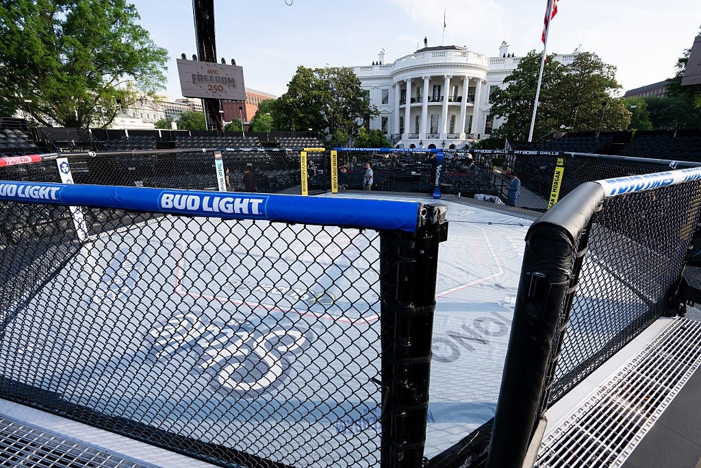 MMA octagon acceptable   up   outdoors adjacent   a salient  achromatic  building, suggesting a high-profile lawsuit   oregon  unsocial   mounting  for a fight