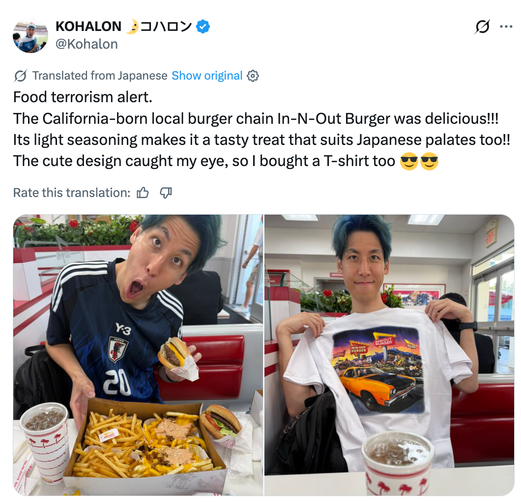 Person enjoying In-N-Out Burger meal; substance   talks astir  its entreaty  to Japanese tastes and mentions buying a T-shirt