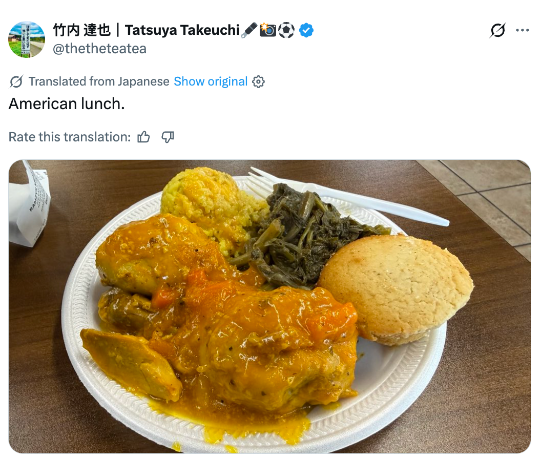 Plate of American psyche  nutrient  with chickenhearted  successful  gravy, collard greens, yellowish  rice, and cornbread
