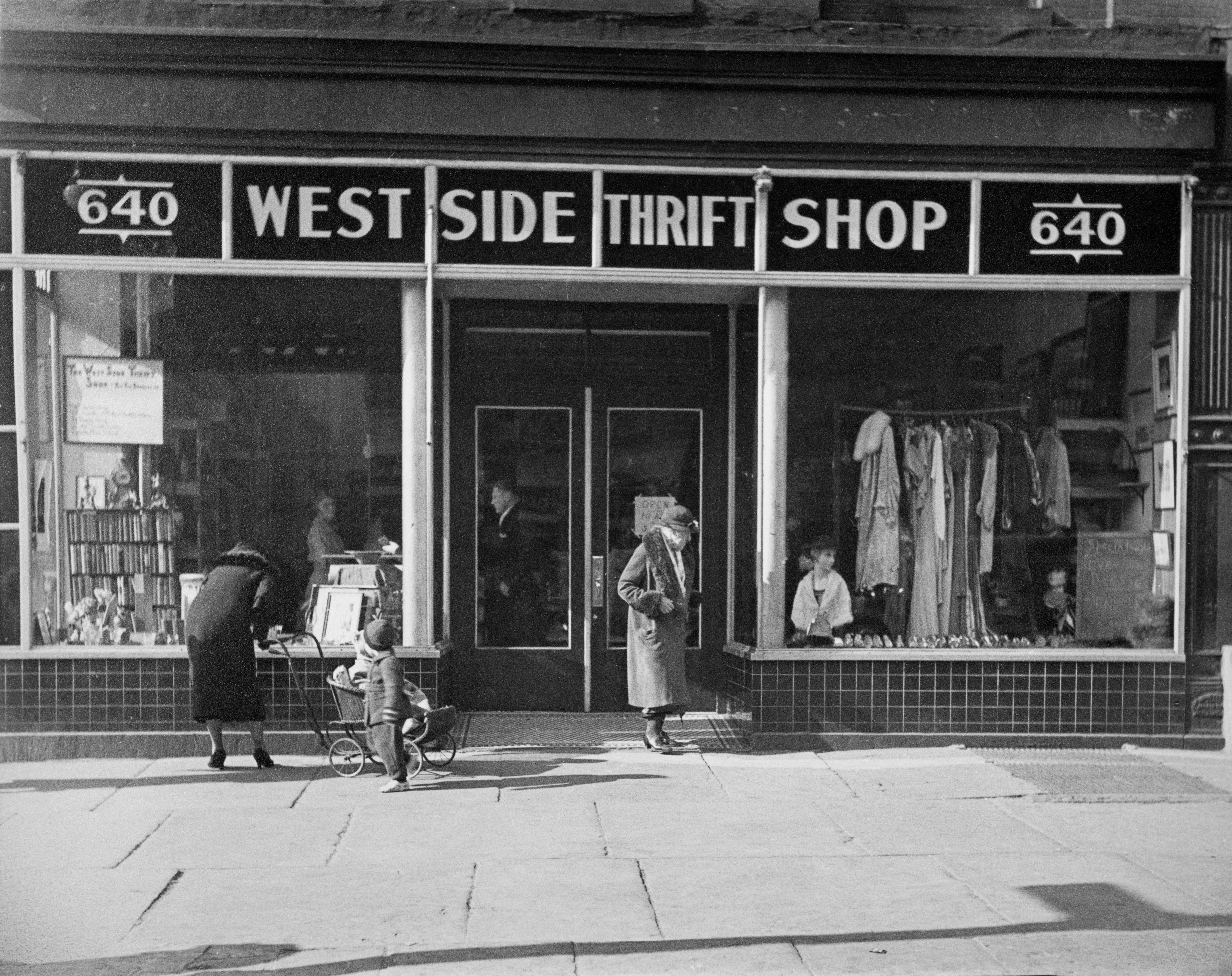 Vintage photograph  of West Side Thrift Shop facade with radical   browsing outside; aboriginal  20th-century thoroughfare  scene