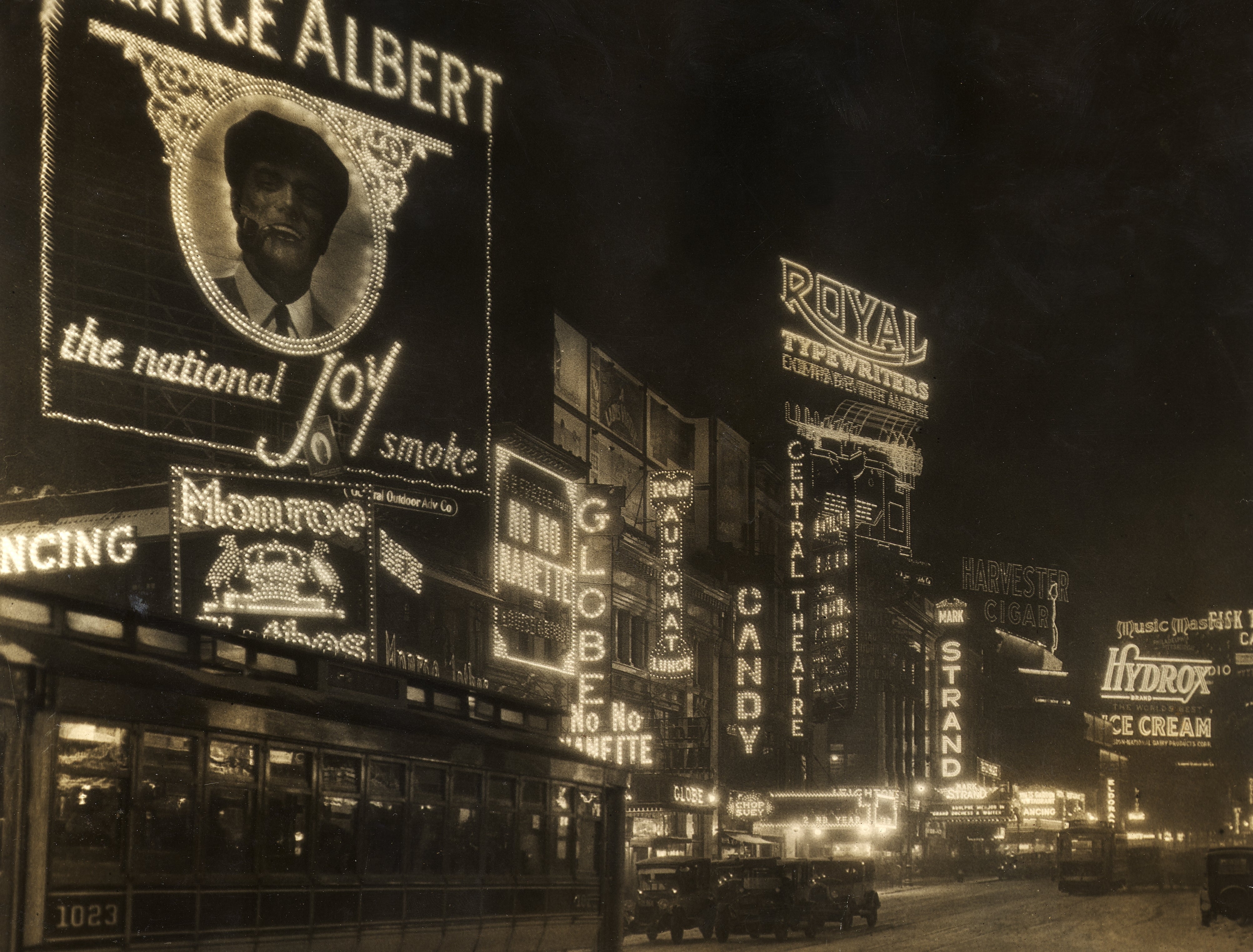 Vintage Times Square country   astatine  nighttime  with glowing neon signs advertizing  tobacco, theaters, candy, and restaurants, capturing a lively atmosphere