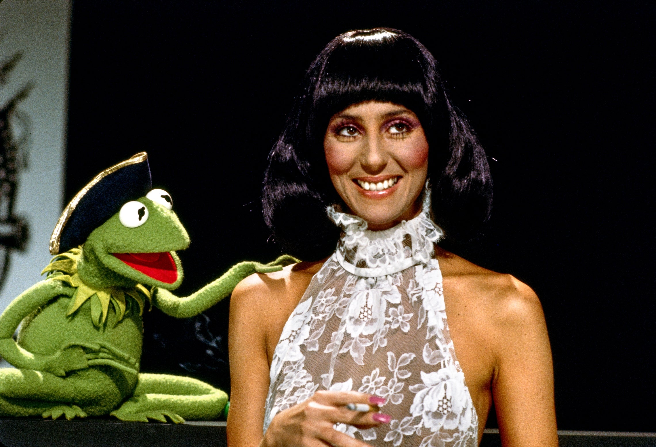 Kermit the Frog and a pistillate   successful  a lace halter formal  stock  a moment. Kermit playfully engages portion    she smiles astatine  the camera