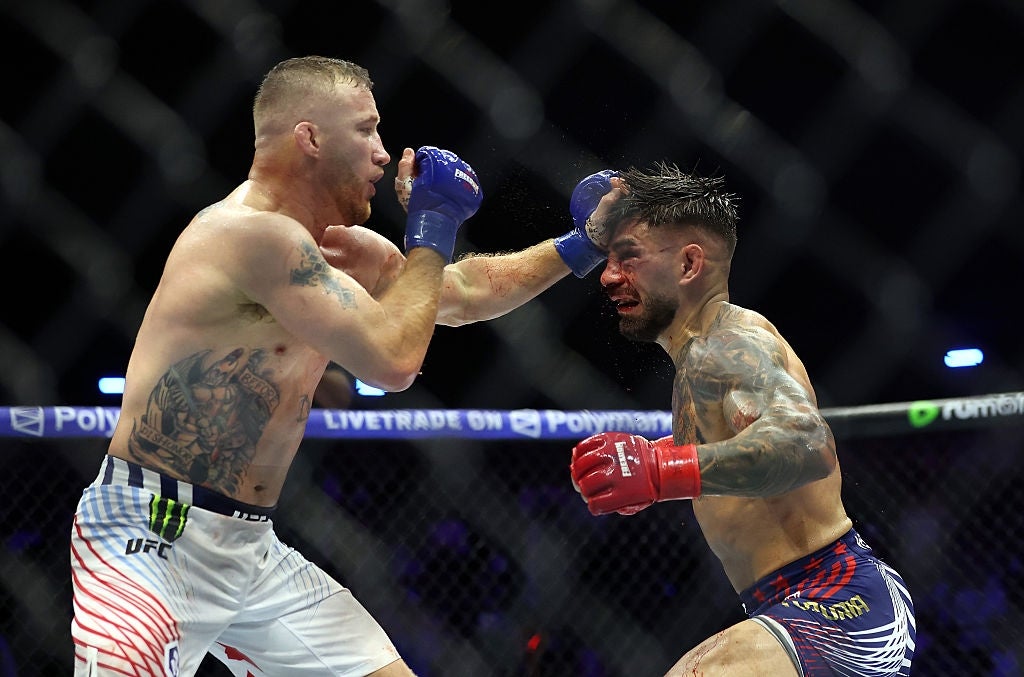 Two MMA fighters successful a cage lucifer exchanging punches, showing aggravated enactment and focus