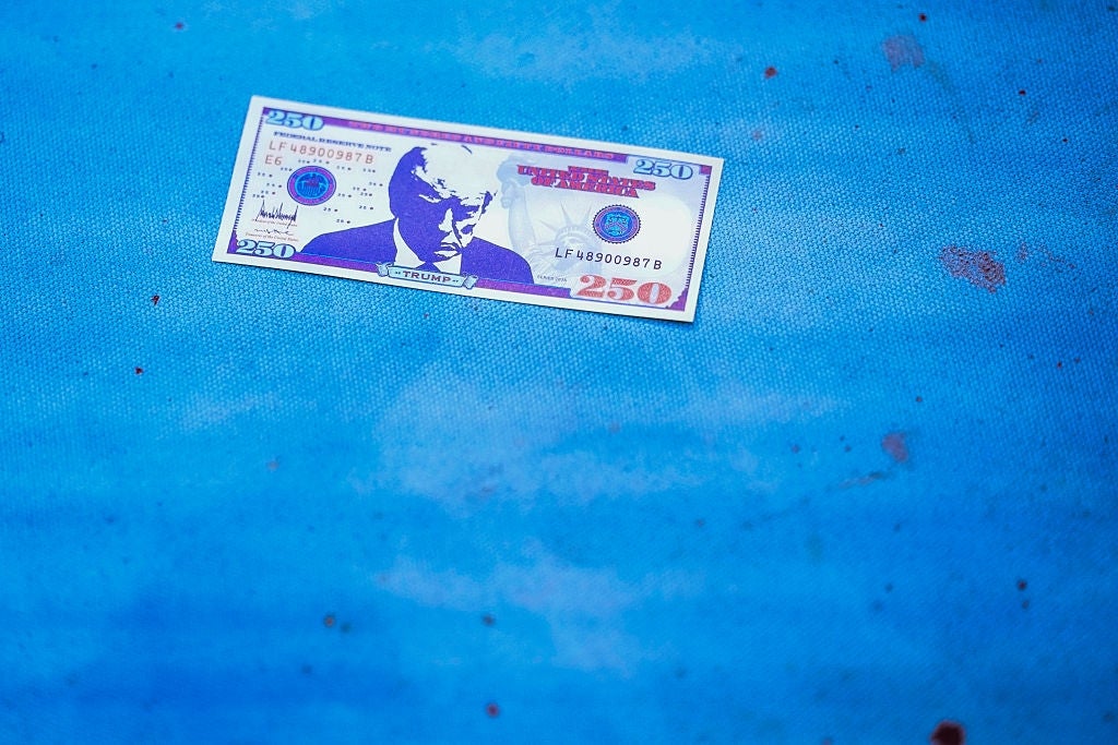 A stylized 250 currency enactment lies connected a textured surface, featuring an illustrated representation of an older man