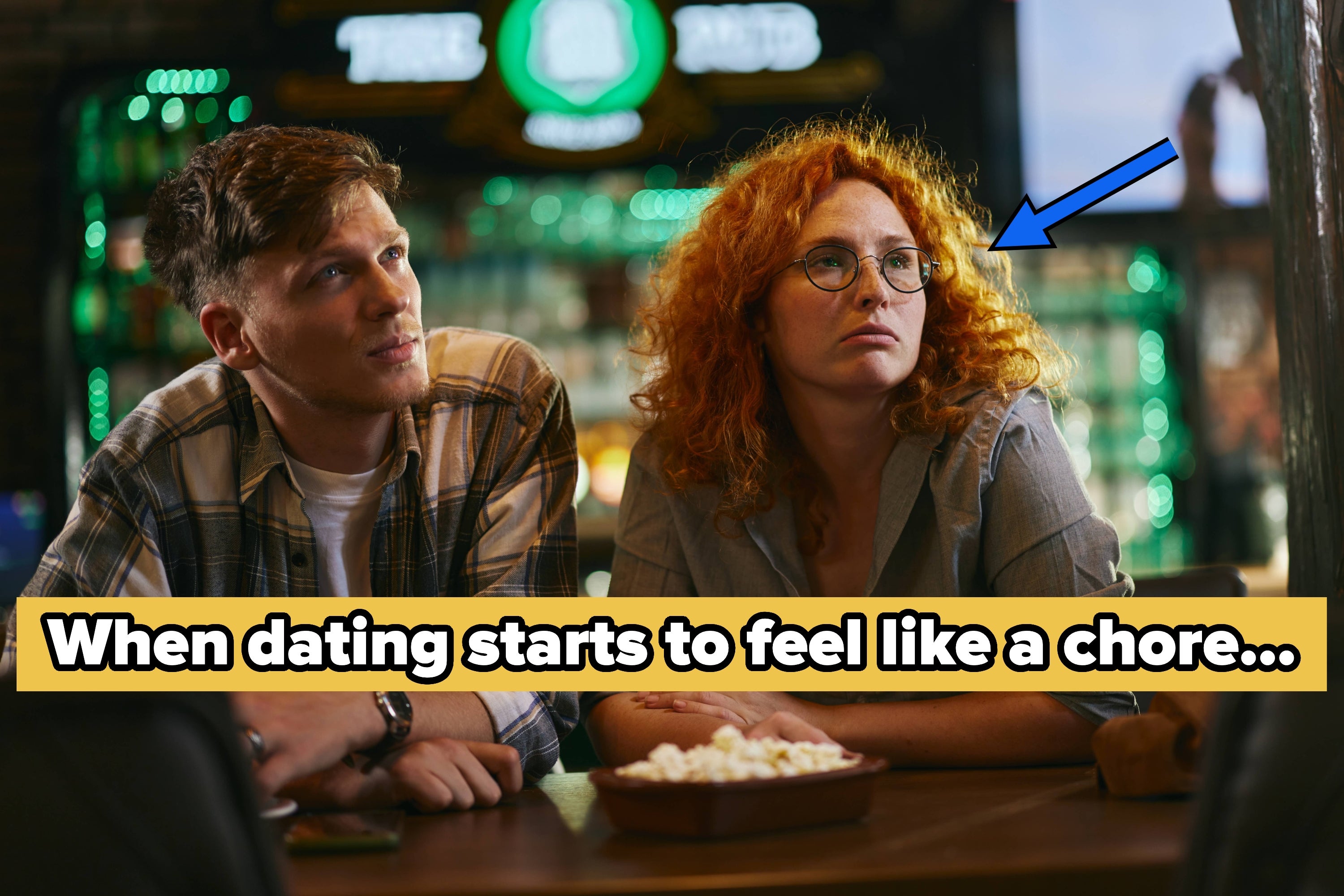 Two people sit at a table looking bored. Text reads: "When dating starts to feel like a chore..."