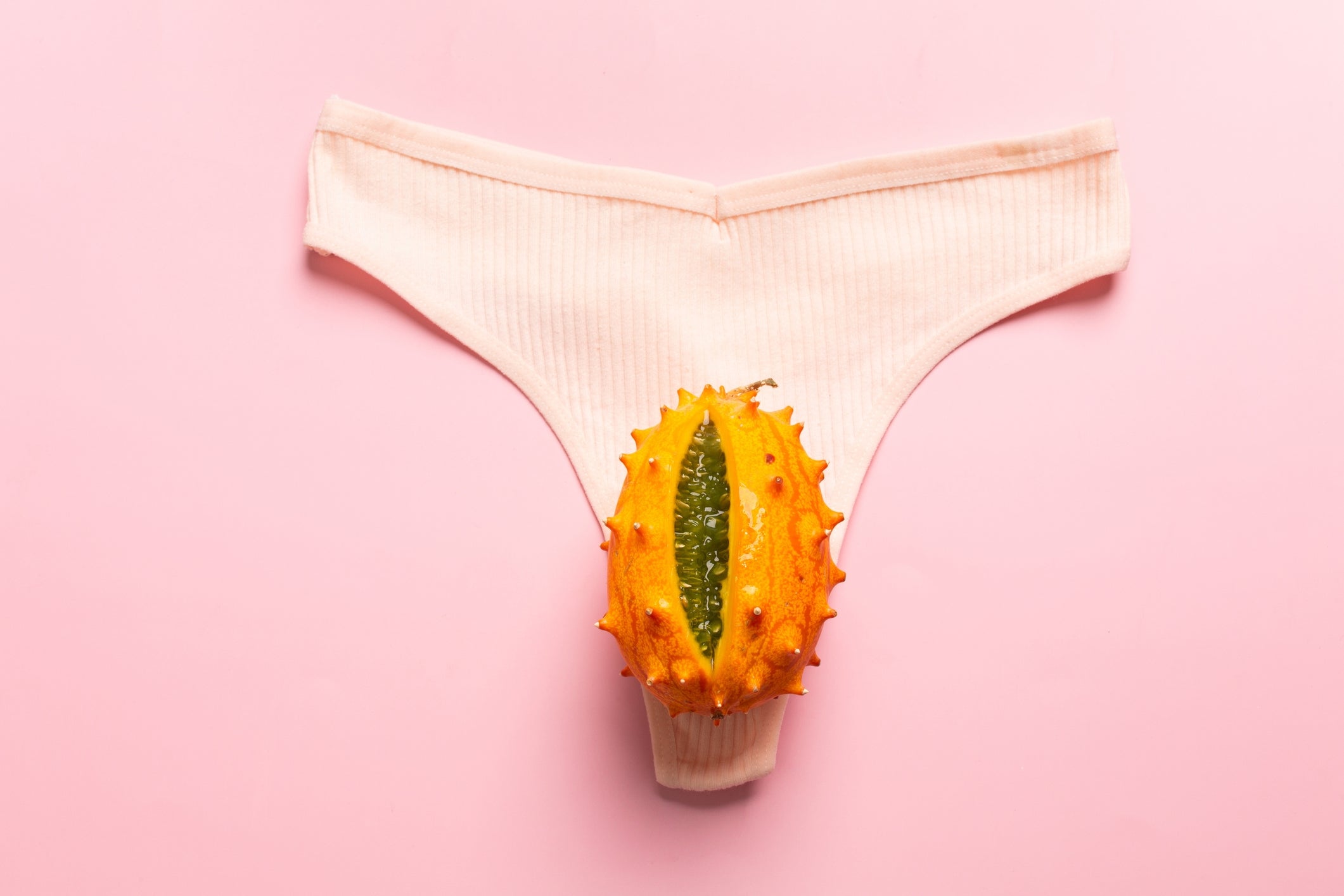 A horned melon is placed connected a brace of underwear, symbolizing wellness and wellness