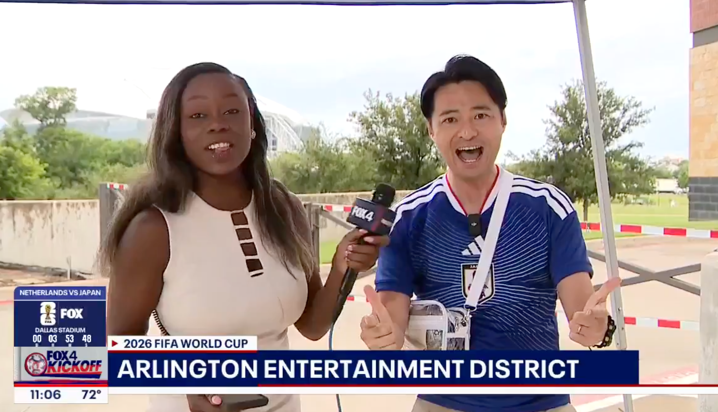 Two reporters enthusiastically broadcasting unrecorded from the Arlington Entertainment District astir the 2026 FIFA World Cup