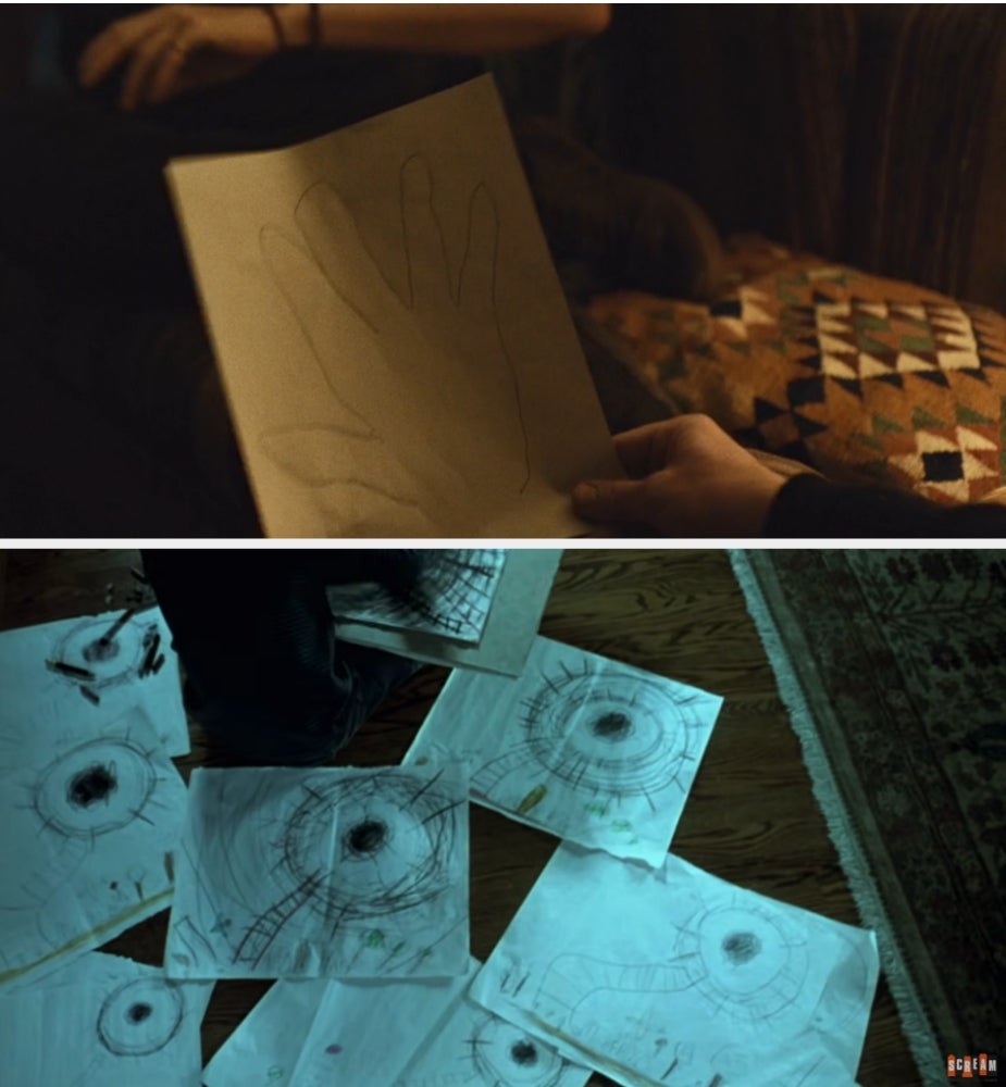A idiosyncratic   holds a drafting  of a manus  outline. Below, respective  papers connected  the level  show  abstract, eye-like sketches and designs