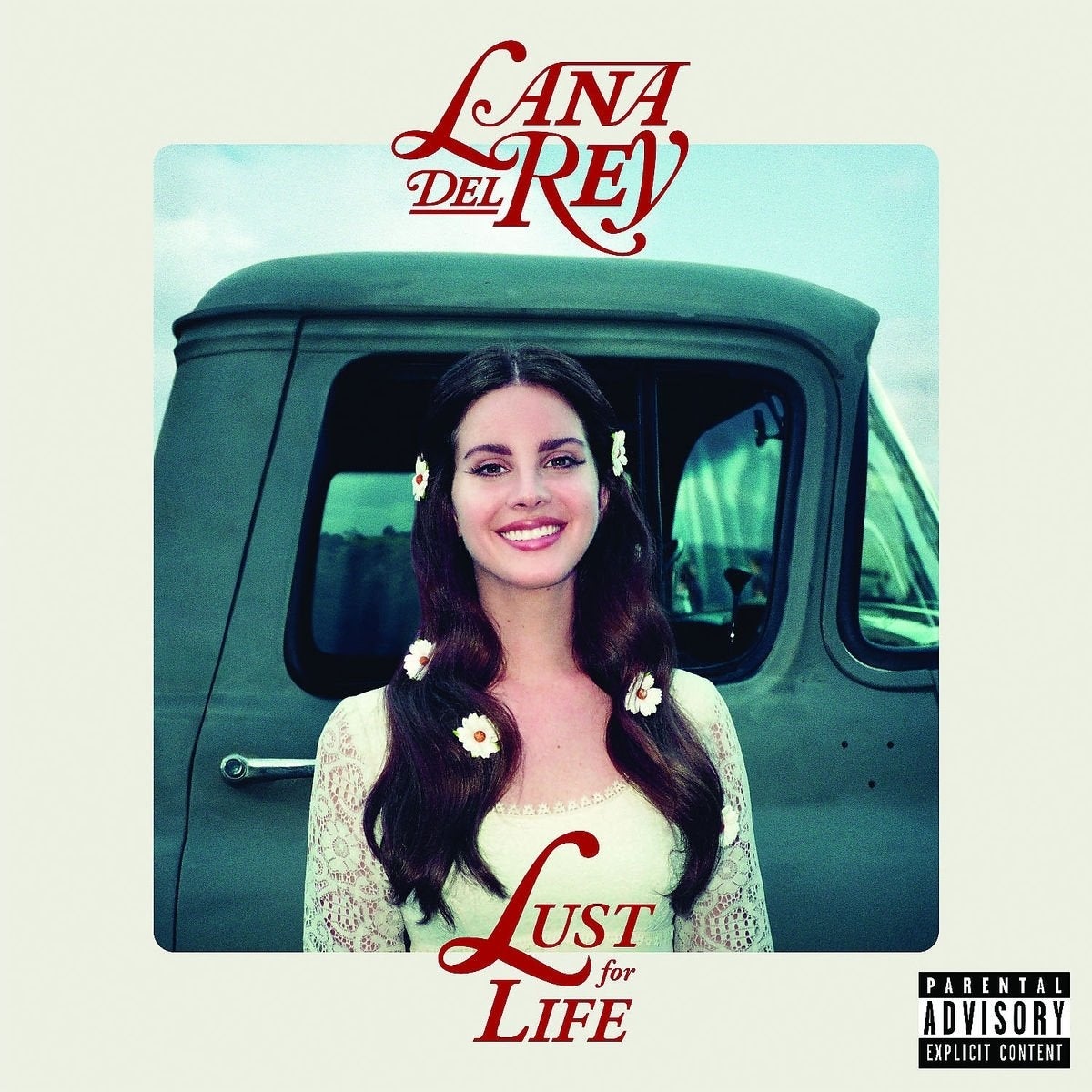 Album screen  of a pistillate   with agelong  hairsbreadth  and floral accents, smiling successful  beforehand   of a truck, titled “Lust for Life” by Lana Del Rey