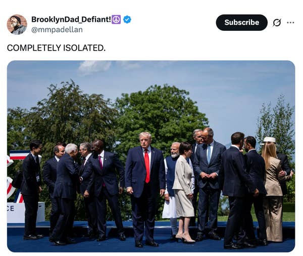 A group of leaders stand together outdoors while one man stands apart, humorously highlighting his social isolation