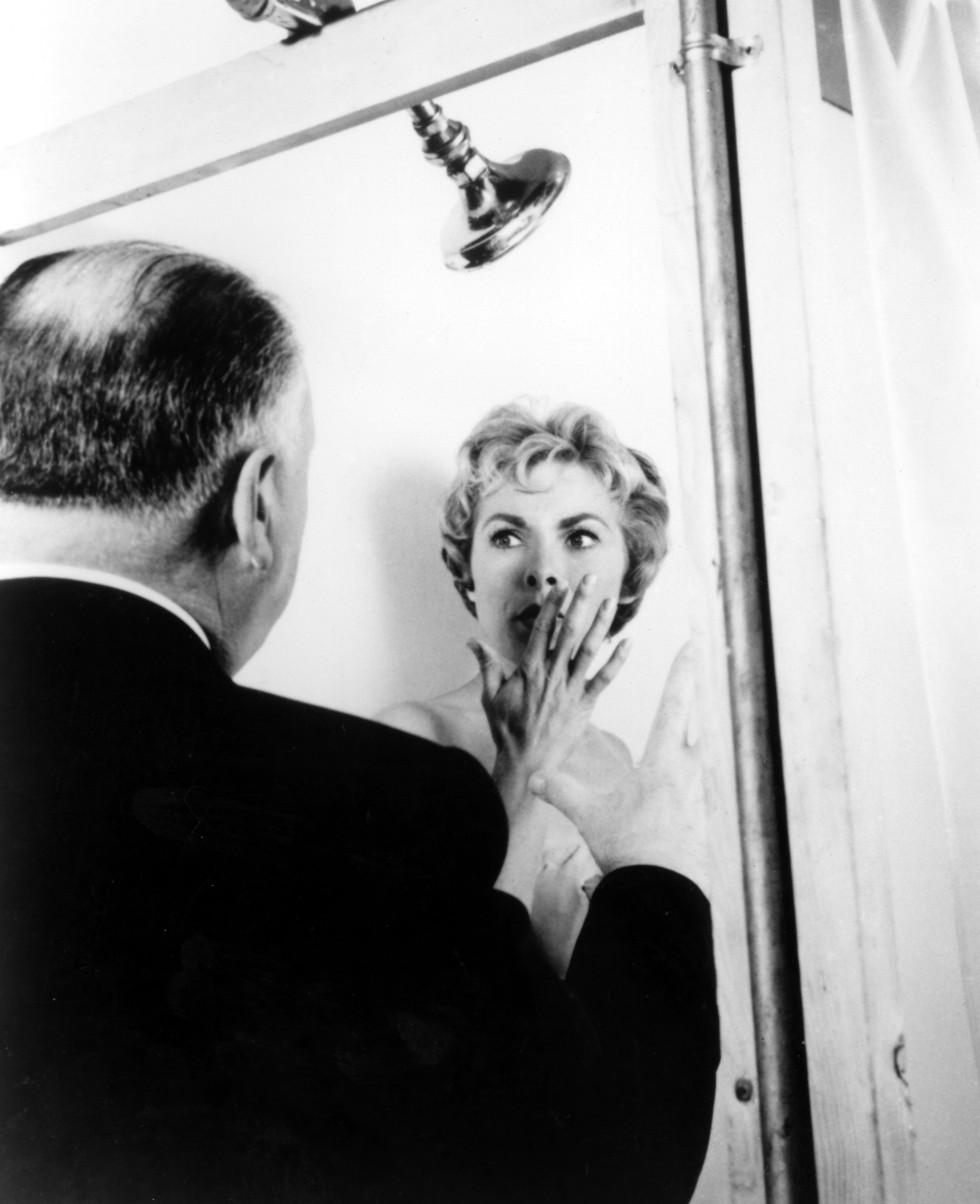 A idiosyncratic   appears frightened successful  a ablution  country   portion    a antheral   successful  a suit   approaches, reminiscent of the iconic infinitesimal   from a classical  thriller film