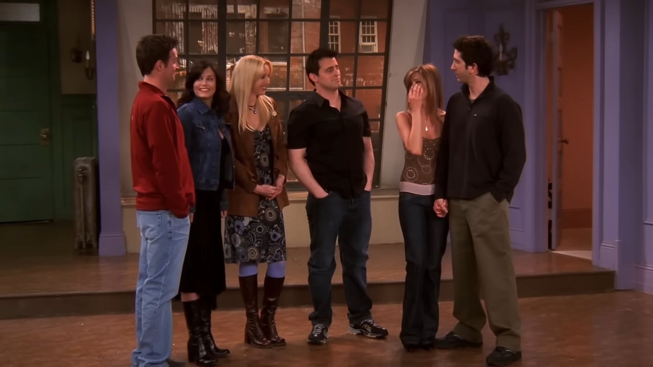 A radical  of six radical   basal   together, casually dressed, successful  a warmly lit room, perchance  a acceptable   from a TV bid    reunion