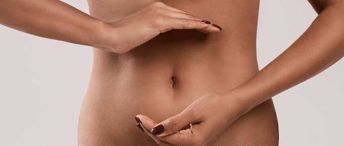 Person's midriff with hands forming a ellipse  implicit    the stomach, suggesting wellness oregon  self-care