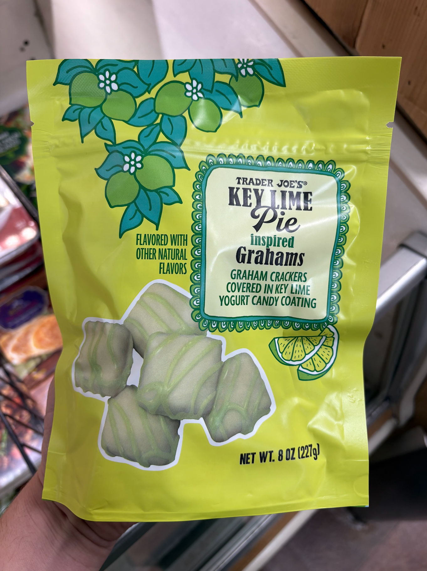 Bag of Trader Joe's Key Lime Pie Inspired Grahams, showcasing graham crackers covered in key lime yogurt candy coating