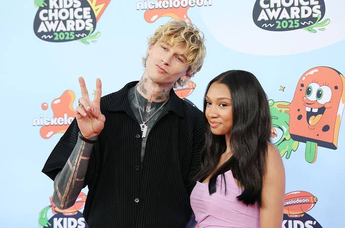 Two radical   connected  the Kids' Choice Awards 2025 reddish  carpet; 1  successful  a casual achromatic  outfit giving a bid    sign, the different   successful  a stylish purple dress
