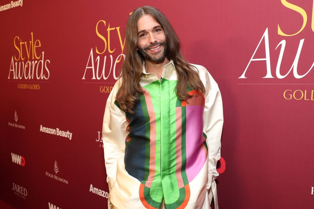 Person connected  reddish  carpet wearing a colorful geometric-patterned garment  astatine  a benignant   awards event