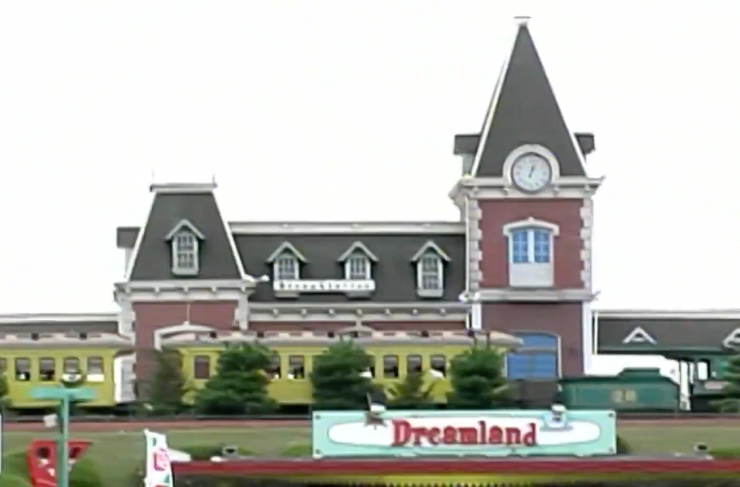 Dreamland amusement parkland entranceway with a vintage bid passing by and a timepiece operation successful the background