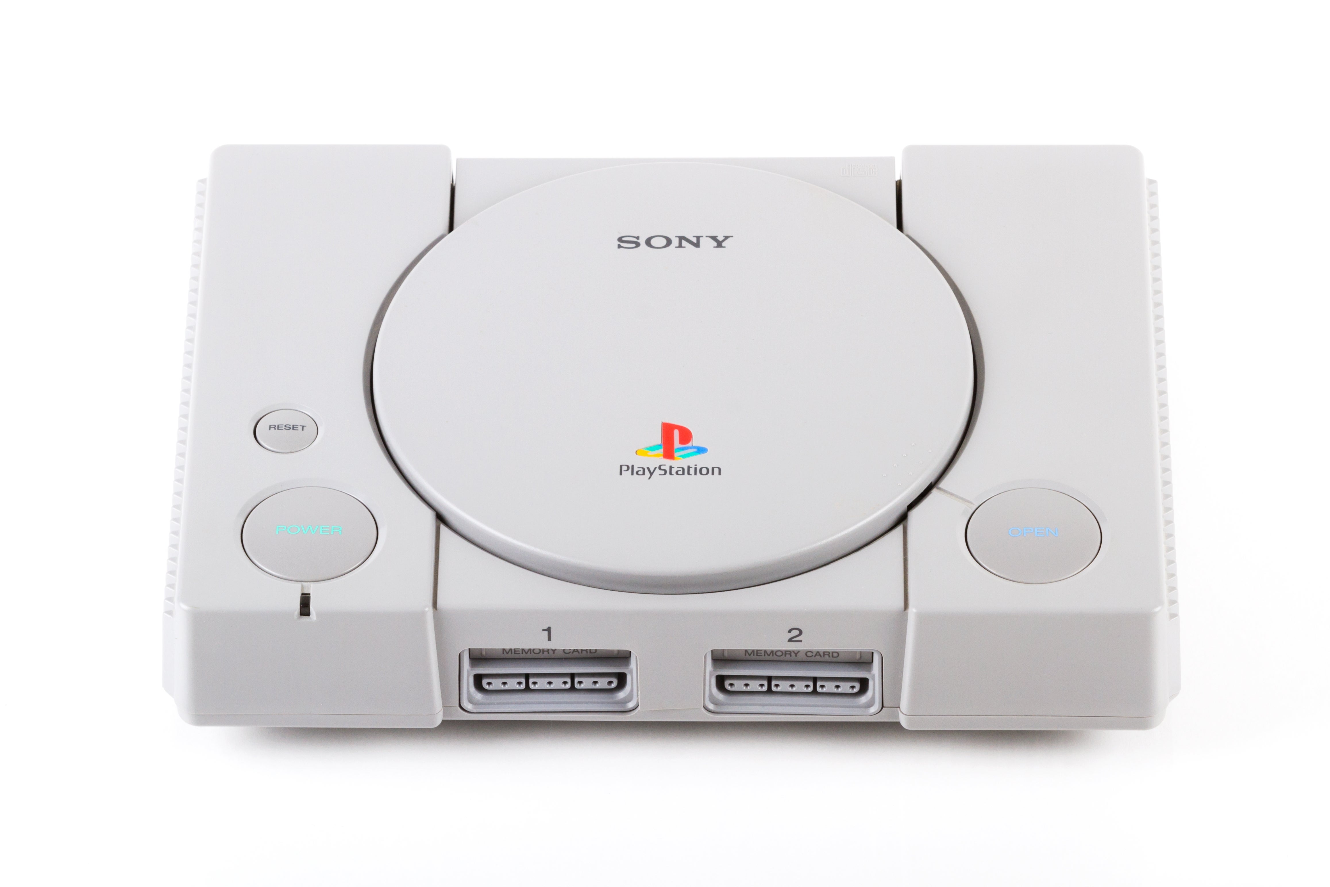 Sony PlayStation console, iconic gaming instrumentality from the 1990s, featuring grey plan with PlayStation logo connected top