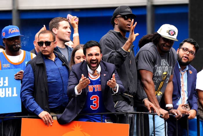 Group of excited sports fans astatine  an outdoor event, 1  wearing a hoops  jersey and passionately cheering