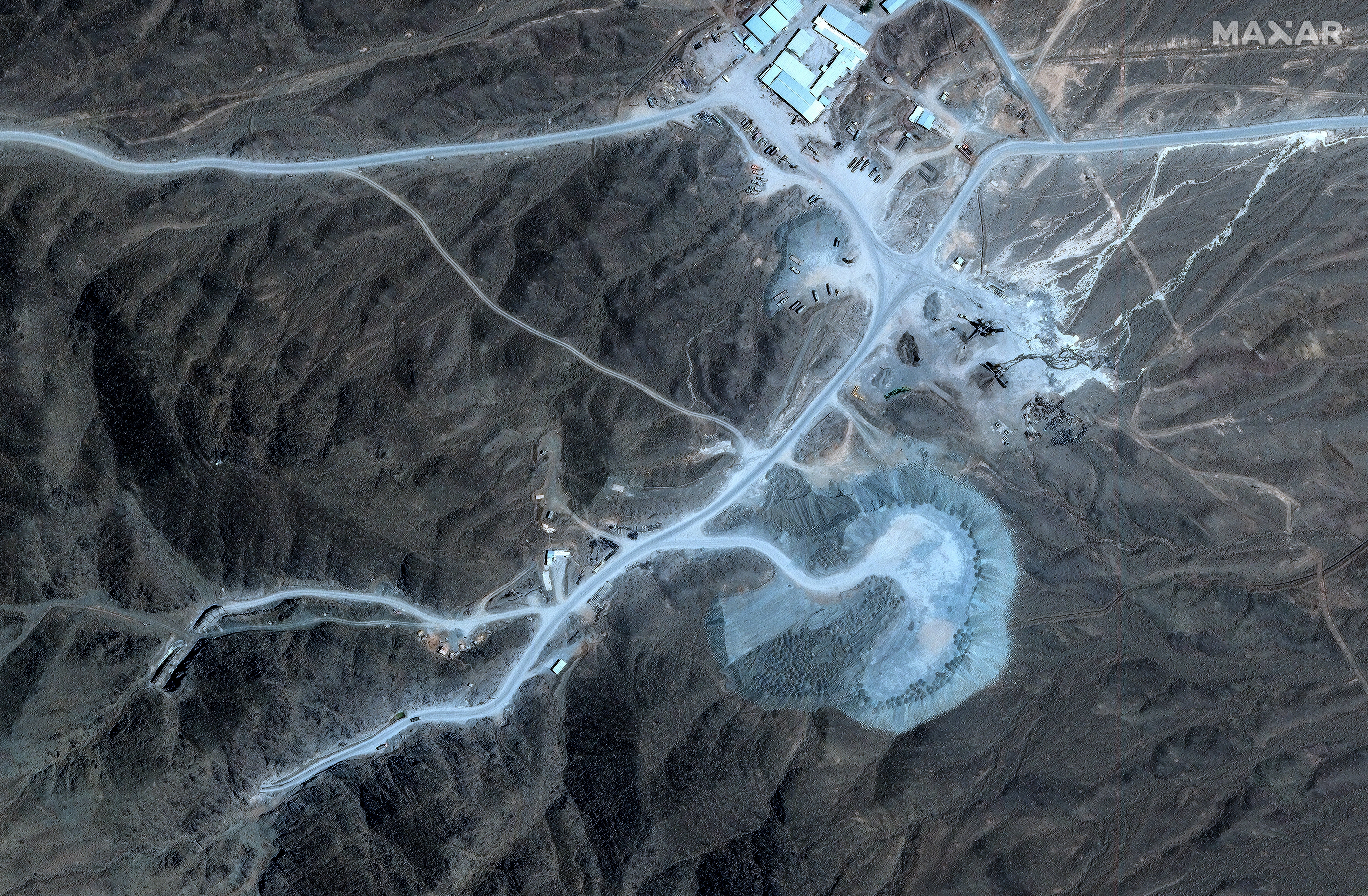 Satellite representation showing a mountainous country with roads and buildings, perchance a operation tract oregon quarry