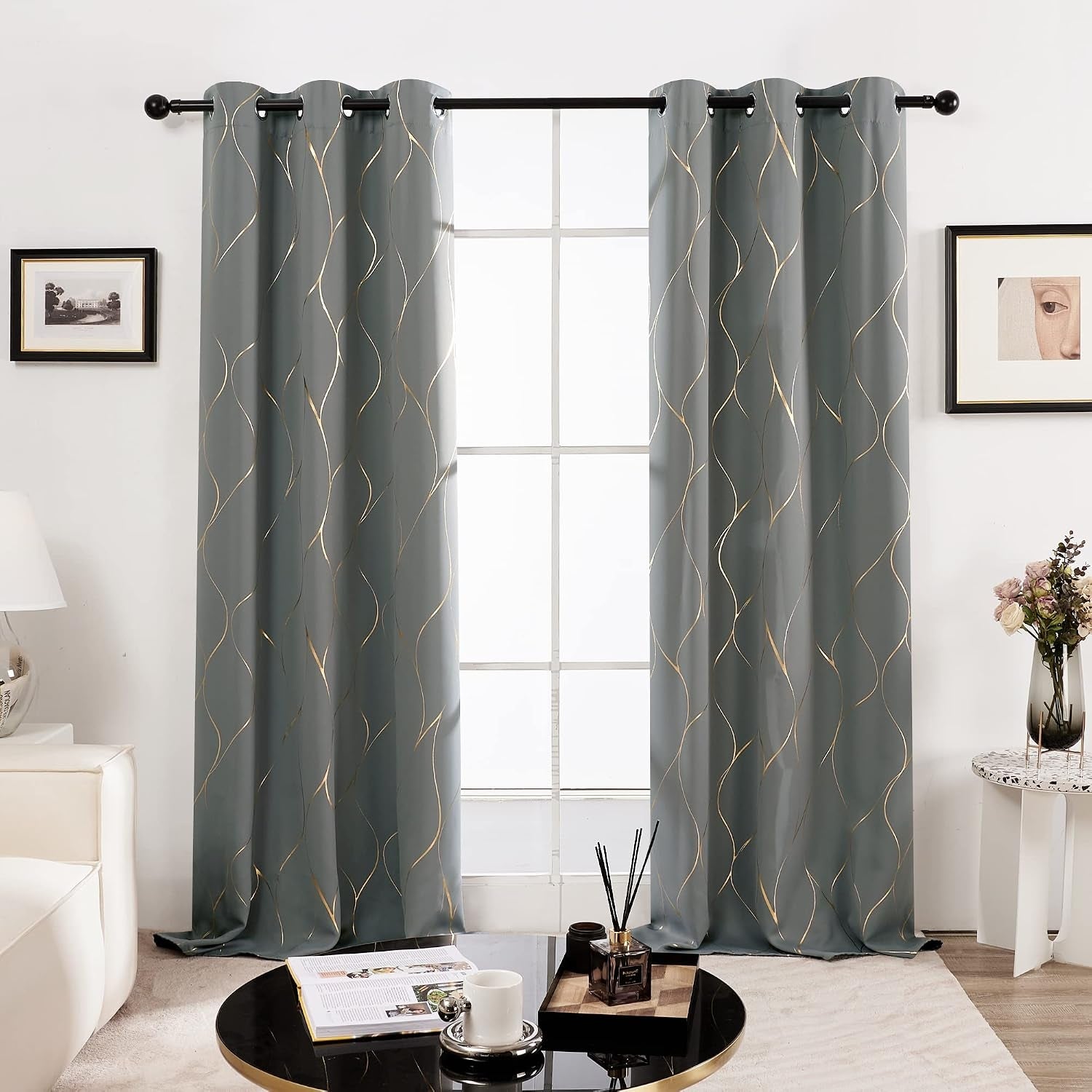 Stylish curtains with subtle signifier   hanging successful  a modern   surviving  room, enhancing the decor with framed creation  and a tiny  circular  array  beside