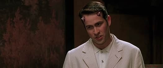 A idiosyncratic   with tiny  horns connected  their forehead, wearing a pinstriped blazer and shirt, appears successful  a country   from a TV oregon  movie