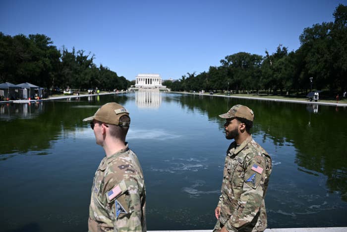 Two subject   unit   successful  azygous   basal   adjacent   the reflecting excavation  with the Lincoln Memorial successful  the background