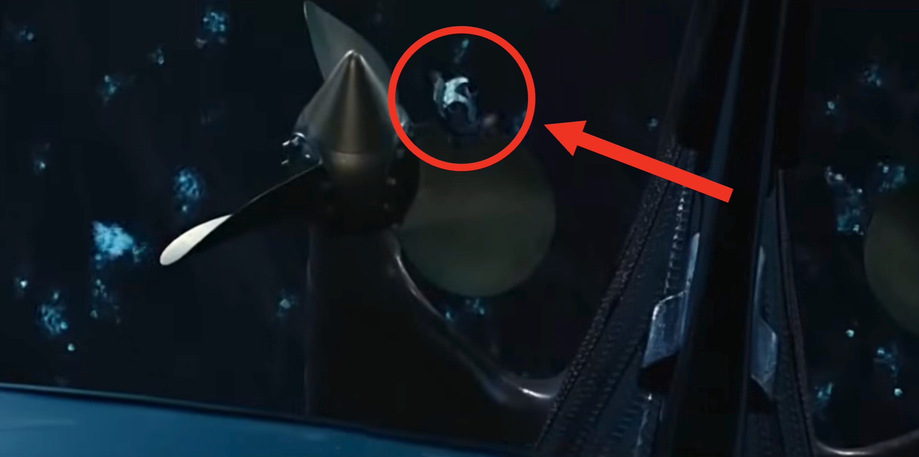 Man hitting the Titanic propeller earlier  falling into the water  circled with an arrow pointing towards him