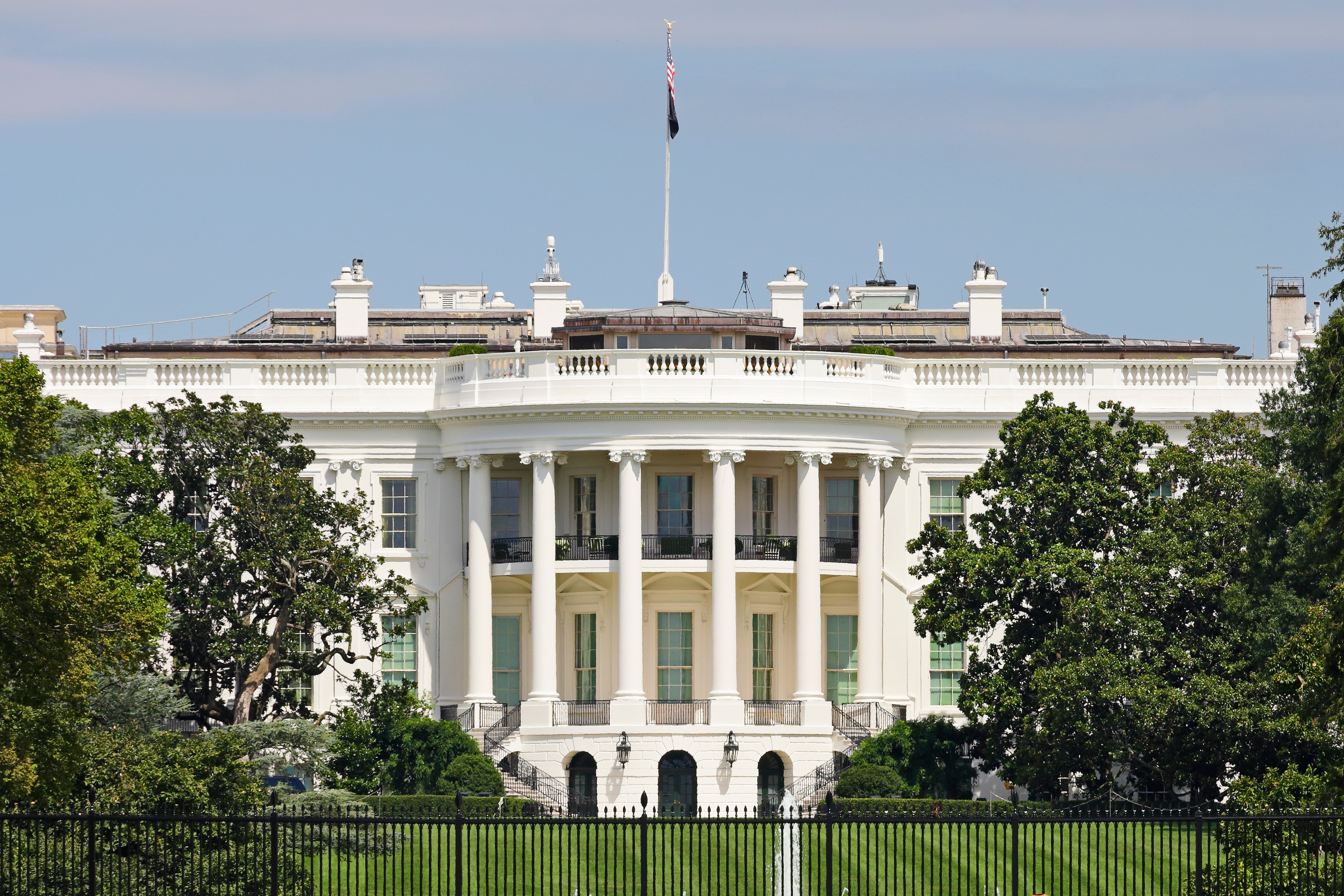 The beforehand presumption of the White House with its iconic columns and lawn, surrounded by trees, nether a wide sky