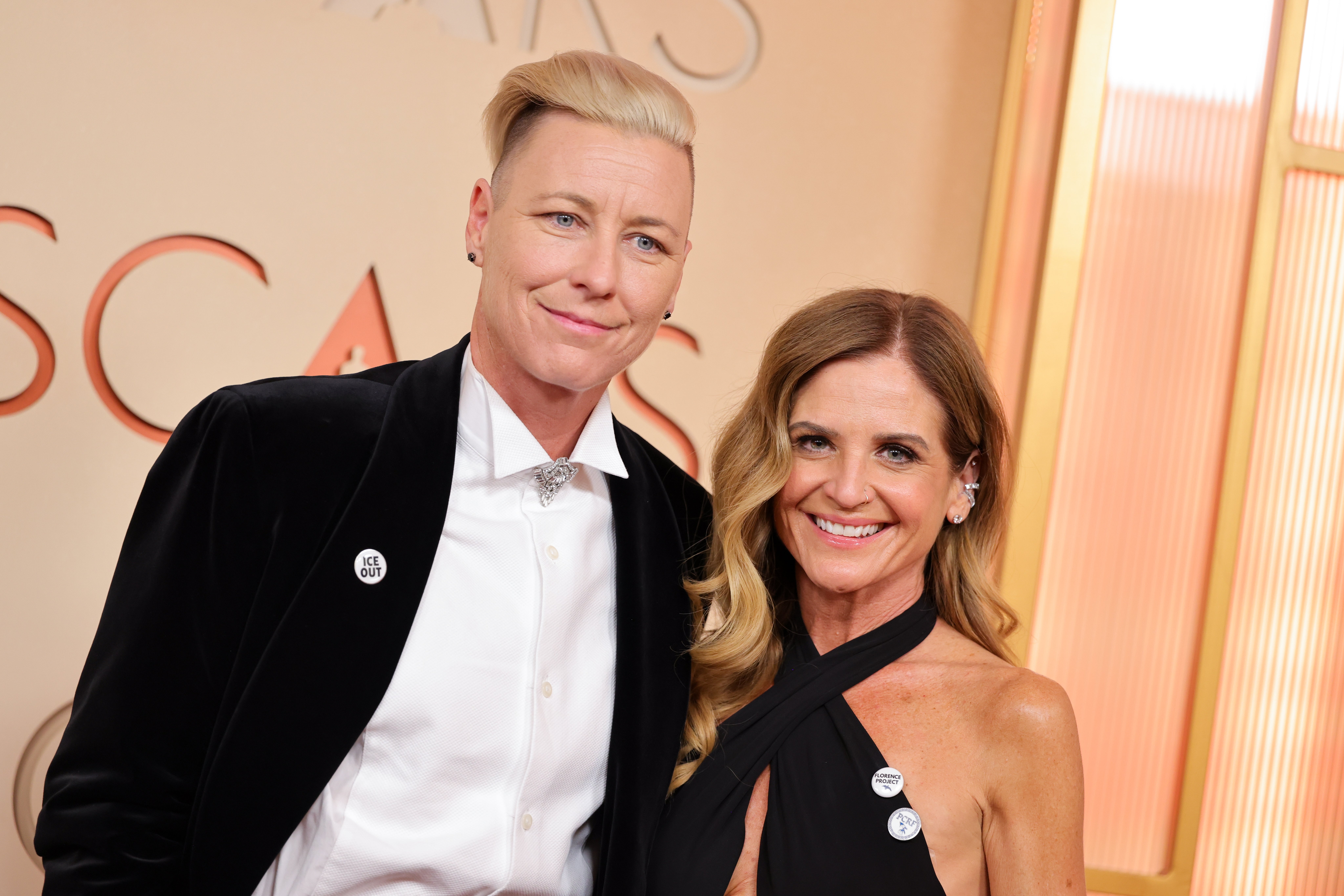 Two individuals successful ceremonial attire airs unneurotic connected a reddish carpet. The idiosyncratic connected the near wears a achromatic suit, and the idiosyncratic connected the close wears a achromatic dress