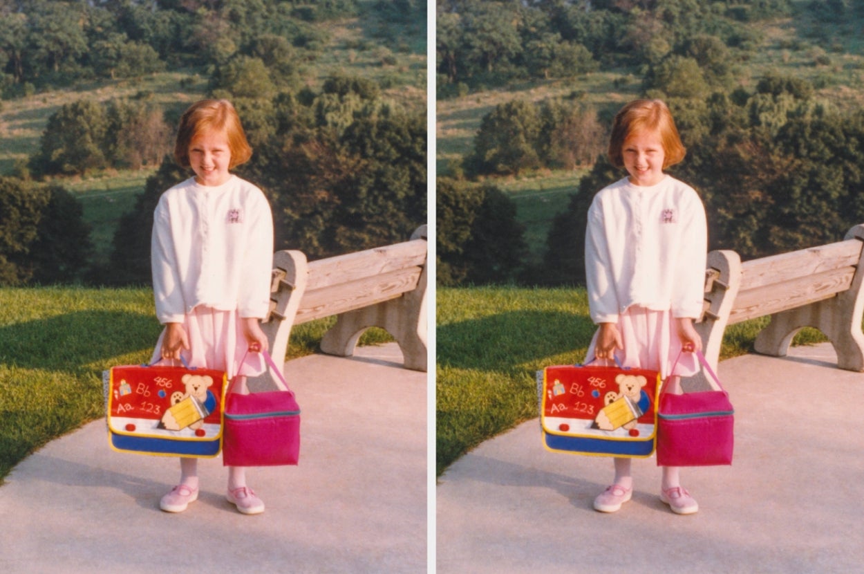 Child smiling outdoors, holding school bags, with a park backdrop. Dressed in a casual outfit, standing confidently on a patio area