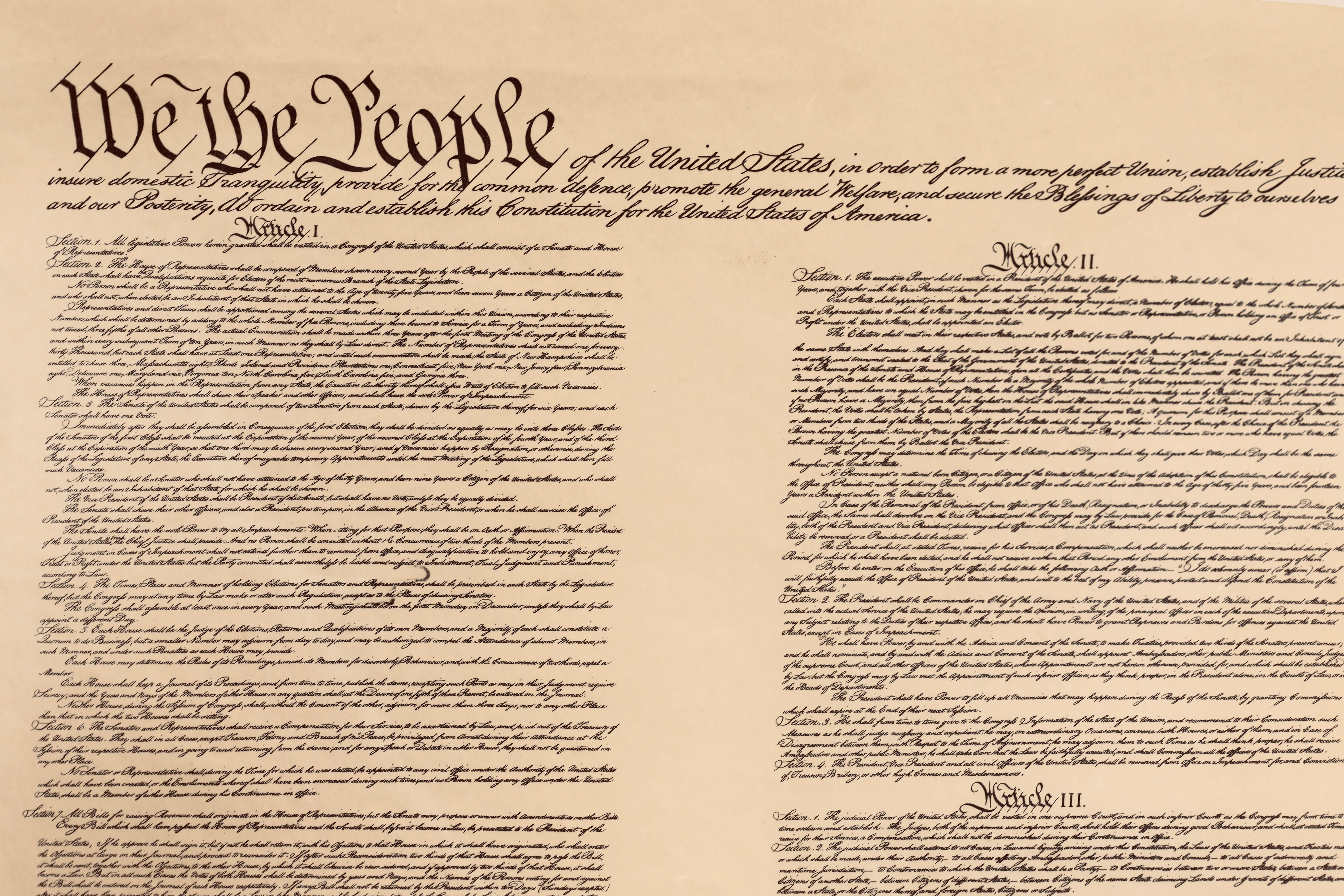 The representation  shows the United States Constitution's archetypal  leafage   with the Preamble and Articles I done  III