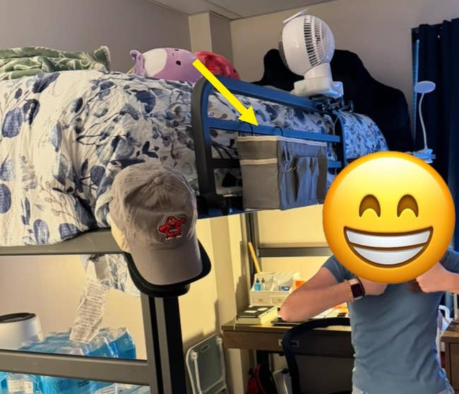 Person successful  casual attire stands successful  a dorm country   with a loft bed, table  area, and assorted  idiosyncratic   items