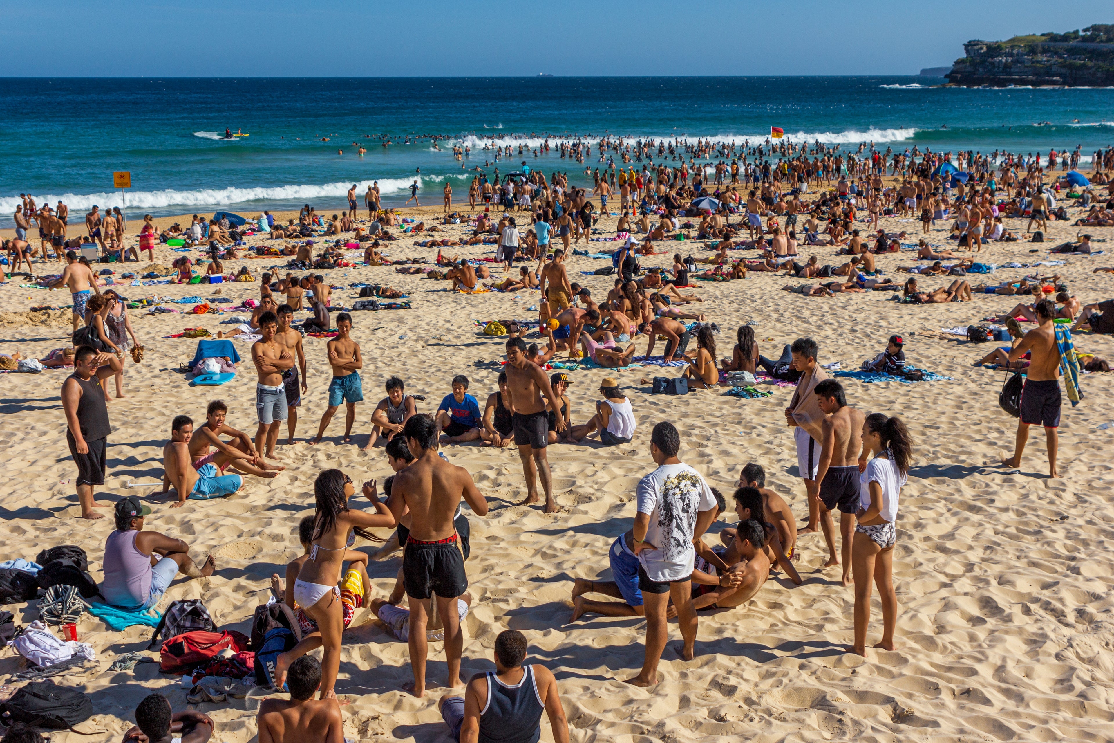 Crowded formation with radical lounging, playing, and swimming; suggests a fashionable question destination