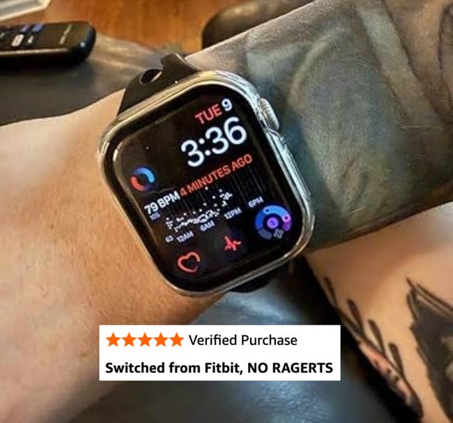 Person wearing a smartwatch displaying time, bosom rate, and fittingness data. The ticker has a achromatic band, shown connected a tattooed arm
