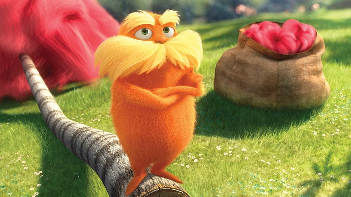 Animated quality  with a bushy mustache stands connected  a histrion   trunk successful  a grassy field, adjacent  to a sack and a heap  of tufts. Scene from a movie