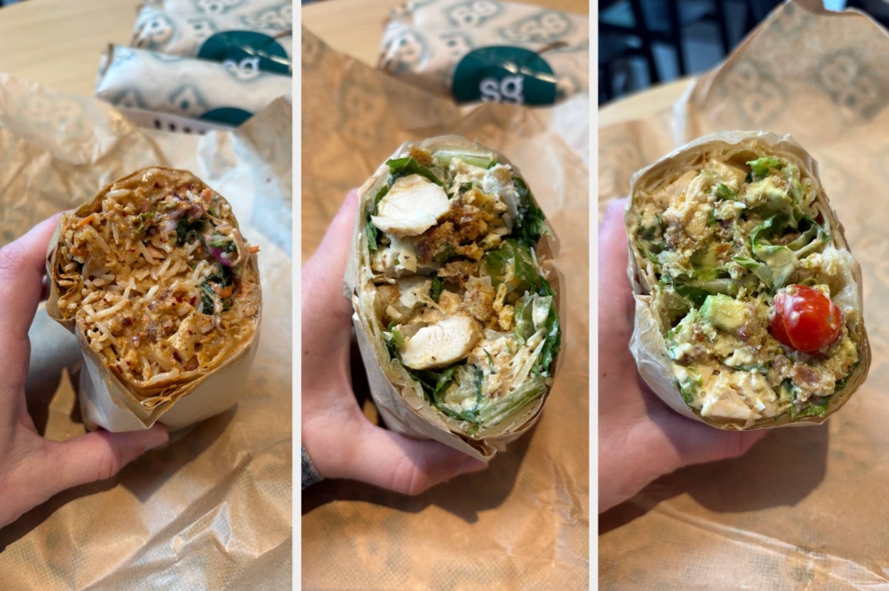 Three sandwich wraps with various fillings including meat, vegetables, and sauces, held in hands on a wrapper-covered surface