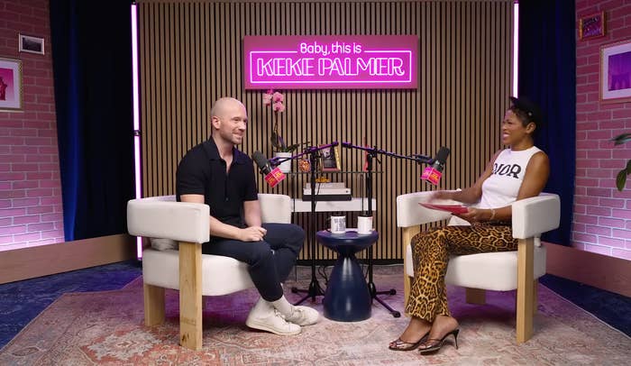 Two radical   beryllium   successful  a modern   podcast workplace  with a neon motion   speechmaking  "Baby, this is Keke Palmer." They look  engaged successful  conversation