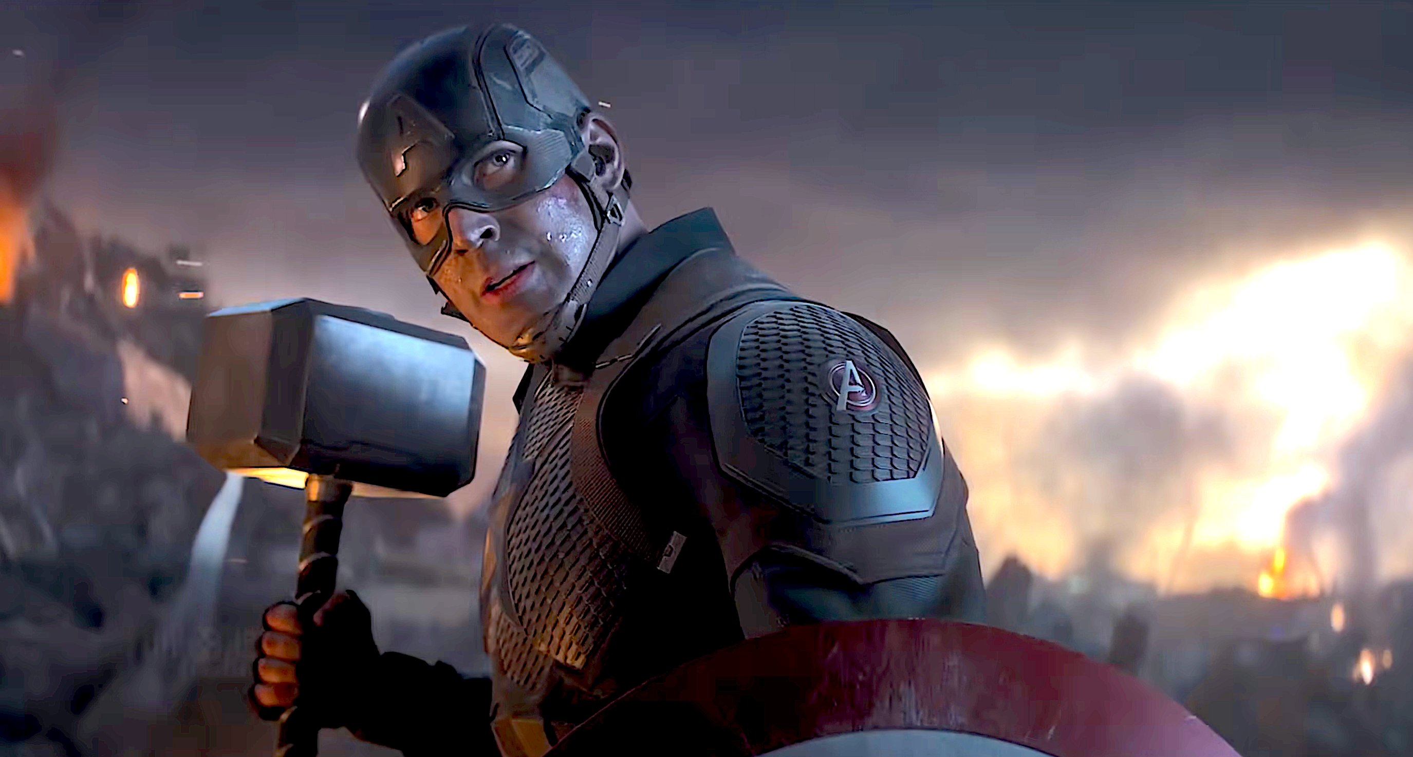 Captain America holding Thor's hammer mid conflict  with wreckage and occurrence  successful  the background